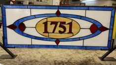 a stained glass sign with the number 751 on it