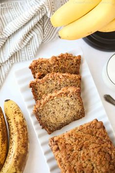 banana and oatmeal bars on a plate next to bananas