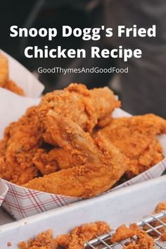 a tray filled with fried chicken on top of a table