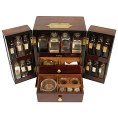 an open wooden box filled with lots of bottles