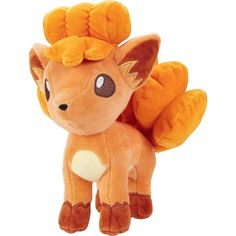 an orange stuffed animal with horns on it's head and ears, sitting in front of a white background