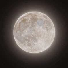 the full moon is seen in the dark sky