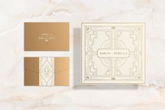 an elegant wedding suite with gold foil on the front and back, along with two matching envelopes