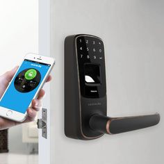 someone is using their phone to open the smart lock on an electronic door handle,