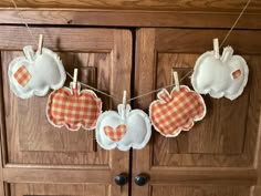 an orange and white gingham apple bunting