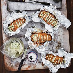 some food is laying out on tin foil and ready to be eaten with sauces