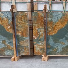 marble slabs are stacked on wooden pallets and ready to be used as wall art