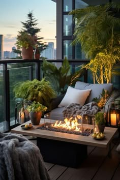 a fire pit sitting on top of a wooden floor next to a lush green plant