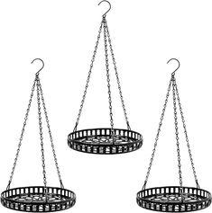 two circular metal baskets hanging from chains