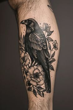 a black bird sitting on top of a person's leg with flowers around it