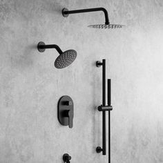 a black and white photo of a shower head, handset, and faucet