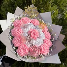 a bouquet of pink and white frosted roses