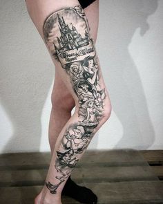 a woman's leg with tattoos on it and an image of a castle in the background