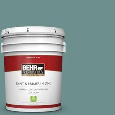 the behr paint and primer in one is shown on a gray background with red trim