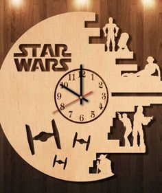 a wooden clock with star wars silhouettes on it's face and the time