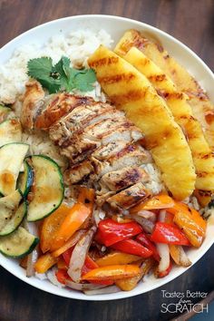 a plate with chicken, rice and veggies on it is shown in an instagram