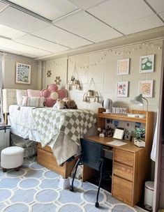 a bed room with a neatly made bed and desk