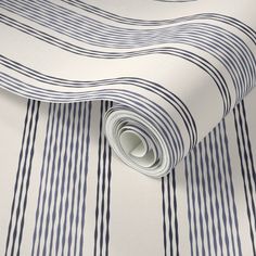 a blue and white striped wallpaper with stripes