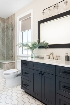 herringbone and hexagon tile navy blue cabinets bathroom shower Blue Bathroom Cabinets Farmhouse, White Bathroom Dark Cabinets, Dark Navy Bathroom Cabinets, Bathroom Floor Tile Ideas With Blue Vanity, Navy Blue Bathroom Cabinets With Black Hardware, Dark Tile Master Shower Ideas, Master Bath Remodel Navy Vanity, Bathroom Flooring With Dark Cabinets, Navy Bathroom Vanity Black Hardware