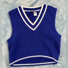 Size Xs Never Worn 100% Acrylic Blue And White Trendy Blue Sleeveless Sweater, Trendy Sleeveless Blue Sweater, Trendy Fitted Blue Sweater Vest, Blue Fitted Sweater Vest For Spring, Fitted Blue Sweater Vest For Spring, Trendy Blue H&m Tops, Casual Blue Sweater Vest For Spring, Blue Knit Vest, School Minimalist