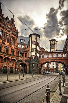 an old brick building with a bridge over it