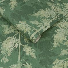 a green and white wallpaper with trees on it