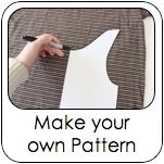 a person cutting out a piece of white paper with the words make your own pattern