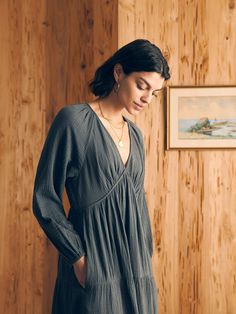 Crafted from our signature Dream Cotton Gauze — an airy organic double gauze fabric —our new Sirene silhouette embodies carefree, sunkissed days. Long billowy sleeves and a tiered maxi skirt heighten the romance factor while the forgiving, slip on silhouette means you're as free as the breeze. This one's sure to become a Faherty icon. Fit: Relaxed fit, Length: 46" Detail: Midi length long sleeve dress with encased elastic for sleeve cuffs. V-neckline. Two tiers at skirt. Material: 100% Organic Cotton, Elastic Model: Bianca is 5'10 wearing size Small Care: Turn inside out. Machine Wash cold separately. Delicate cycle. Do not bleach. Tumble dry low. Remove promptly. Cool iron when needed. WDS2403-WBK Billowy Sleeves, Tank Jumpsuit, Tall Men Clothing, Midi Dress Style, Tiered Maxi Skirt, Double Gauze Fabric, Knit Blazer, Gauze Fabric, Double Gauze