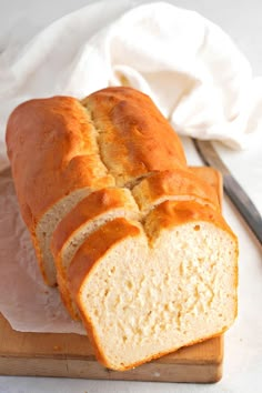 a loaf of bread sitting on top of a cutting board