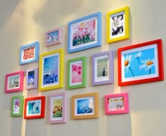 a wall with many different colored frames on it