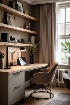 a desk with a chair, lamp and bookshelf in front of a window