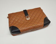 An elegant classic style bag with a legendary design that marks deeply the modern fashion, made of excellent quality genuine greek grained calf leather (calfskin). The bag's inner space includes 1 zipped pocket and 2 additional pockets on the other side.  Dimensions: Height 14 cm x Length 20 cm x Width 6 cm (5.5 x 7.9 x 2.4 inches). The bag can be used as a top handle bag or envelope bag. The total chain's length is about 130 cm (51.18 inches). We may apply any preferable length for the chain also, according to your demands. The female model that has been used for the measurements is 1.67 m tall (65.7 Inches). The bag arrives with a special fabric case also, as a cover for it and a small token of appreciation for selecting ''Virsa Bags''. Please expect your package delivered early: You may Luxury Brown Bag With Fold Over Clasp, Luxury Brown Shoulder Bag With Fold Over Clasp, Luxury Brown Flap Bag With Fold Over Clasp, Luxury Brown Envelope Clutch, Classic Brown Shoulder Bag With Fold Over Clasp, Business Brown Shoulder Bag With Fold Over Clasp, Classic Brown Flap Bag With Fold Over Clasp, Luxury Brown Shoulder Bag Clutch, Office Brown Satchel With Fold Over Clasp