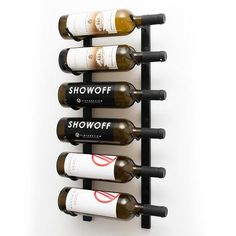 a wine rack with six bottles of wine on it and the words show off in black letters