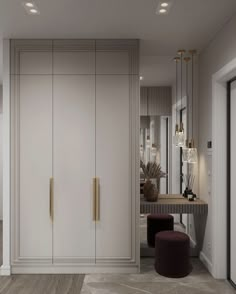 an elegant dressing room with mirrored doors and stools