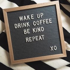 a sign that says wake up drink coffee be kind of repeat xo on it