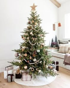 a decorated christmas tree in a living room