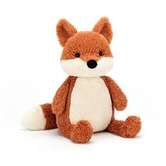 a brown and white stuffed fox sitting down