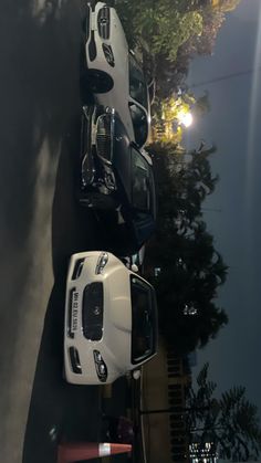 two cars parked next to each other on the street