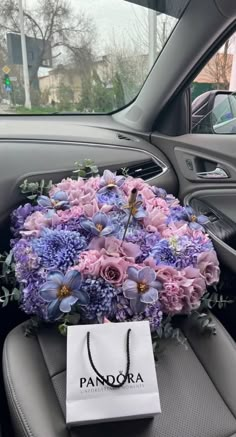 a bouquet of flowers in the back seat of a car