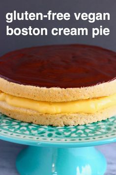 a close up of a cake on a plate with the words gluten - free vegan boston cream pie