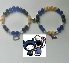 two beaded bracelets with an image of a cat and dog holding each other