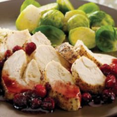 chicken with cranberry sauce and rice on a plate