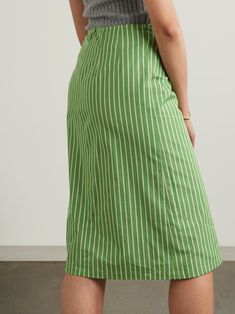 DRIES VAN NOTEN Tie-detailed striped cotton midi skirt | NET-A-PORTER Chic Skirt With Striped Hem And Relaxed Fit, Striped Midi Skirt For Work, Chic Relaxed Skirt With Striped Hem, Summer Workwear Skirt With Vertical Stripes, Chic Vertical Stripes Skirt For Spring, Chic Spring Skirt With Striped Hem, Relaxed Skirt With Striped Hem, Chic Striped Knee-length Bottoms, Cotton Pleated Midi Skirt Dress