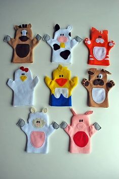 six hand puppets are arranged in the shape of animals