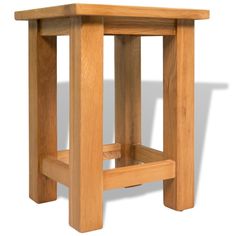 a close up of a small wooden table with one leg on the other side,