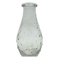 a clear glass vase with water droplets on the bottom and inside, sitting in front of a white background