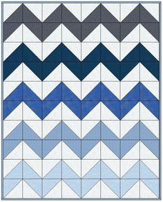 a blue and white chevroned quilt pattern