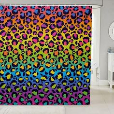 a shower curtain with colorful leopard print on it