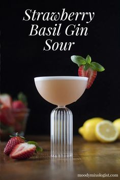 a strawberry basil gin sour cocktail garnished with fresh strawberries