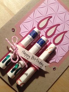 a happy birthday card with crayons and glues on the inside of it